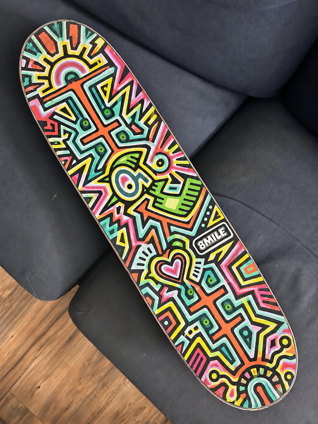 Bright geometric painted skate deck