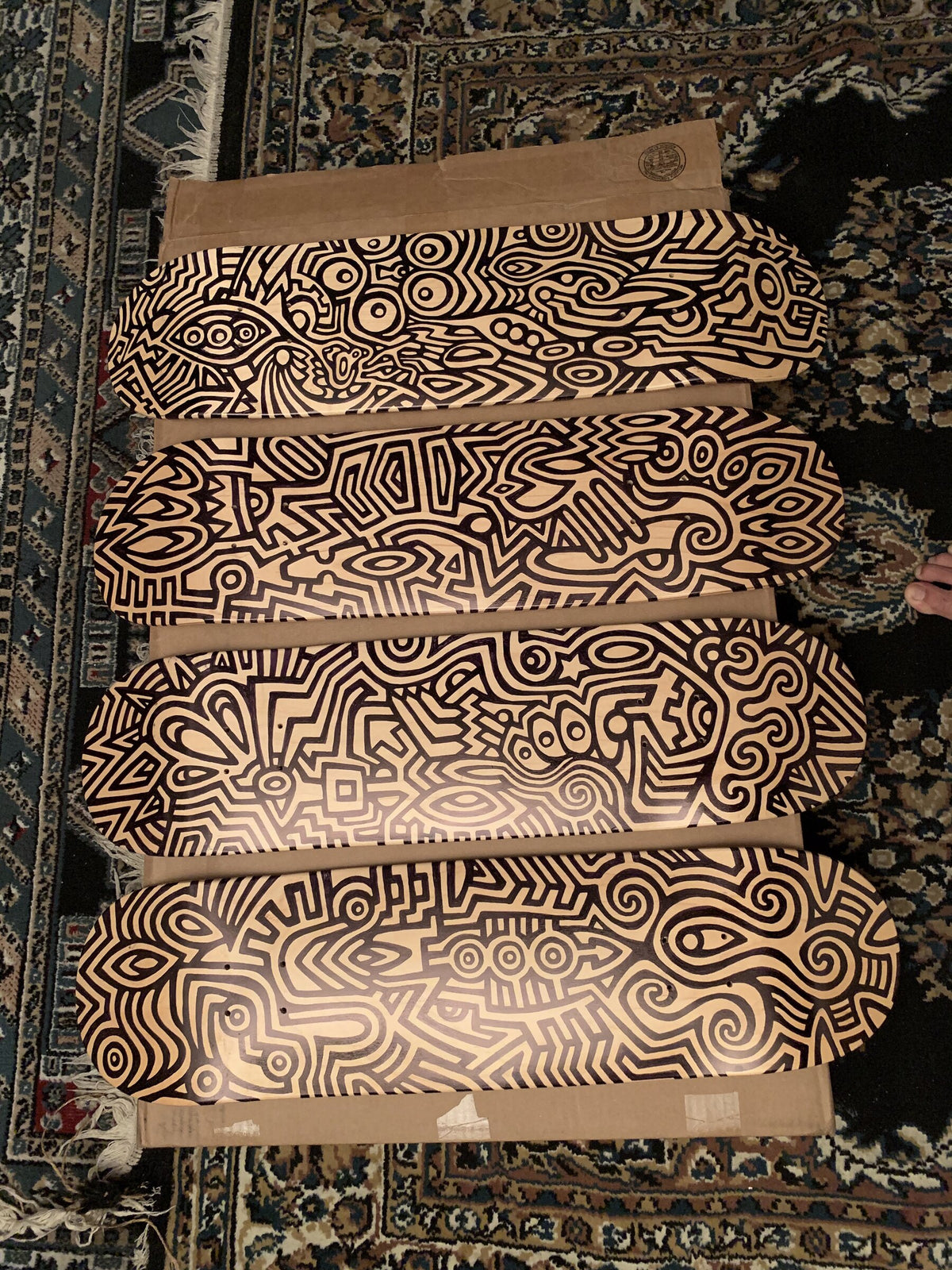 Stack of woodburned skate decks